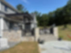 Stone patio with steps and hardscape construction services
