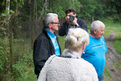Director Nicholas Koscik capturing stills on location for his documentary, Stanisław, about his father's return to Poland after may years away. Next to Nicholas are his father, aunt, and uncle.