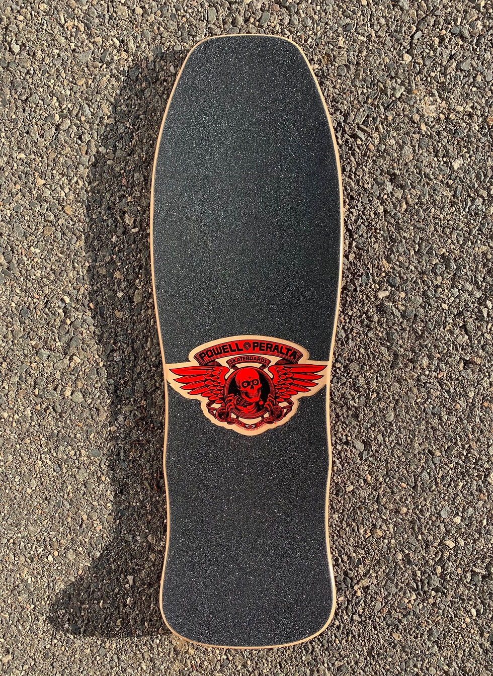 Top view of Powell Peralta skateboard deck with Classic Ripper logo with Die Cut 80's style grip tape set
