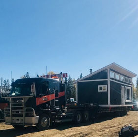 Bishop Towing & Salvage is capable of facilitating all kinds of building moves. Here the crew is relocating a guest house for a customer.