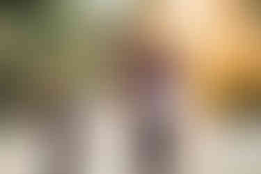 Children running and playing with their parents during an outdoor lifestyle photoshoot