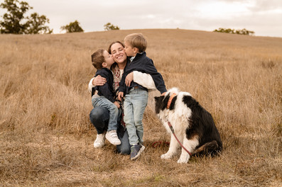 candid pictures of a family in a outdoor field