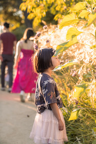 Children running and playing with their parents during an outdoor lifestyle photoshoot