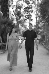 Pregnant woman standing in a garden during a professional maternity session