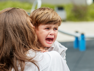 A child having a meltdown due to sensory overload.