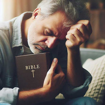 A pastor holding a Bible in his right hand with eyes closed and under stress