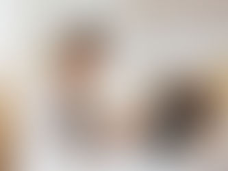 A woman works on her laptop in her living room.