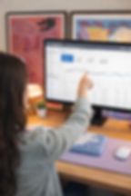 A Google Ads manager points at a graph on the Google Ads dashboard.