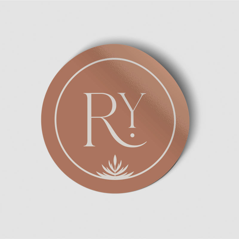 An orange sticker with the "RY" logo mark.
