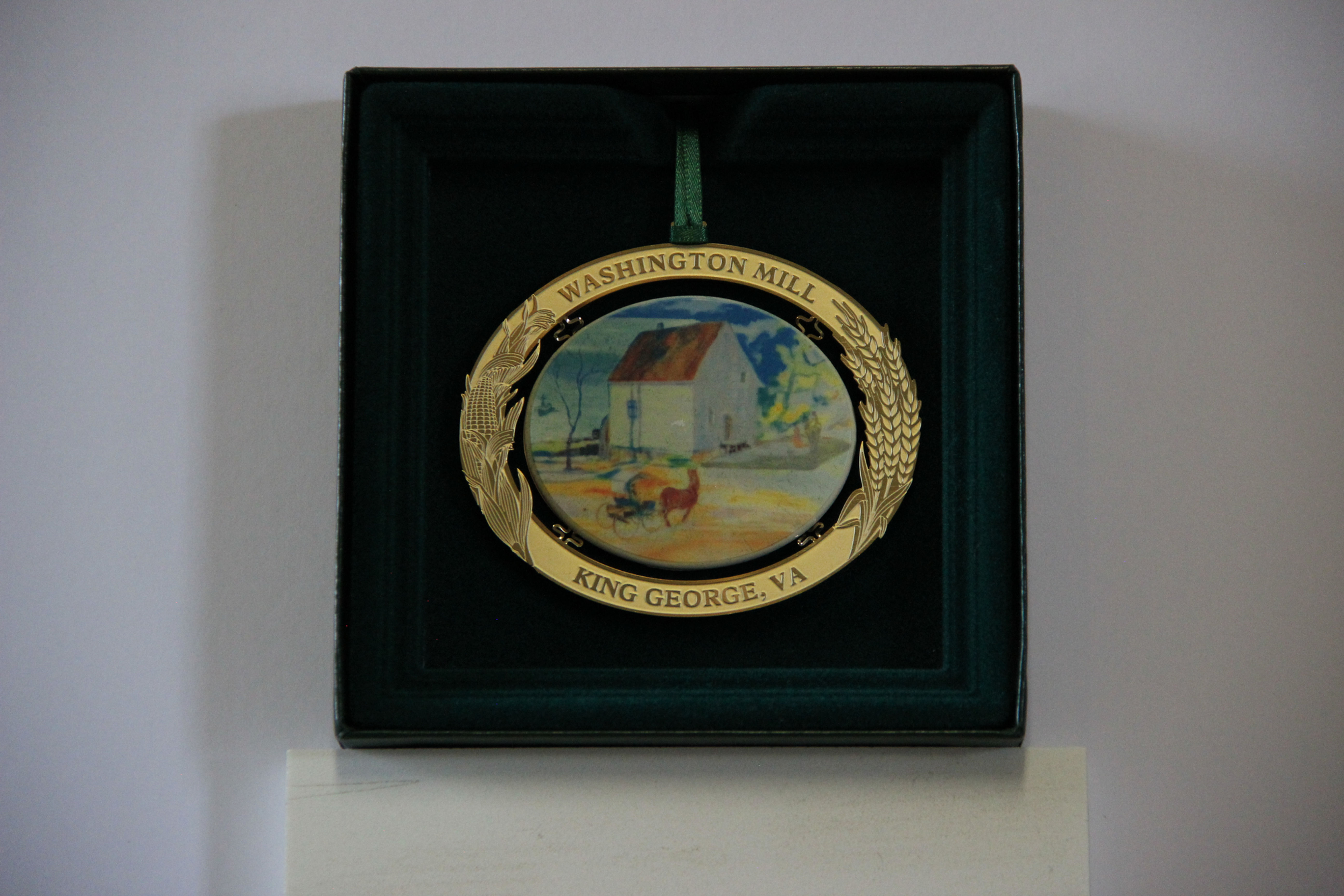 Washington Mill ornament, King George, VA, in a dark green display box.