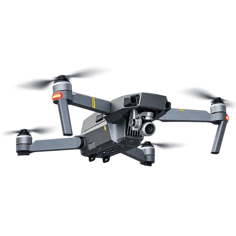 Dron gris en vuelo con hélices borrosas.png