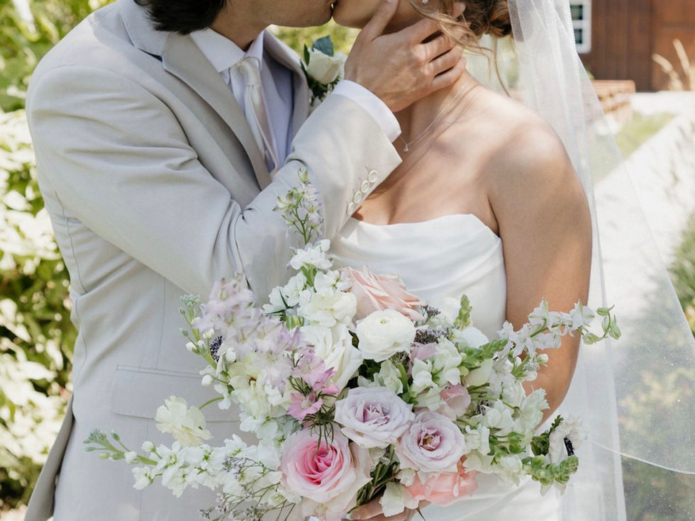 Romantic bridal bouquet with shades of pink, soft white and fresh green blooms at a modern garden-inspired Nebraska wedding
