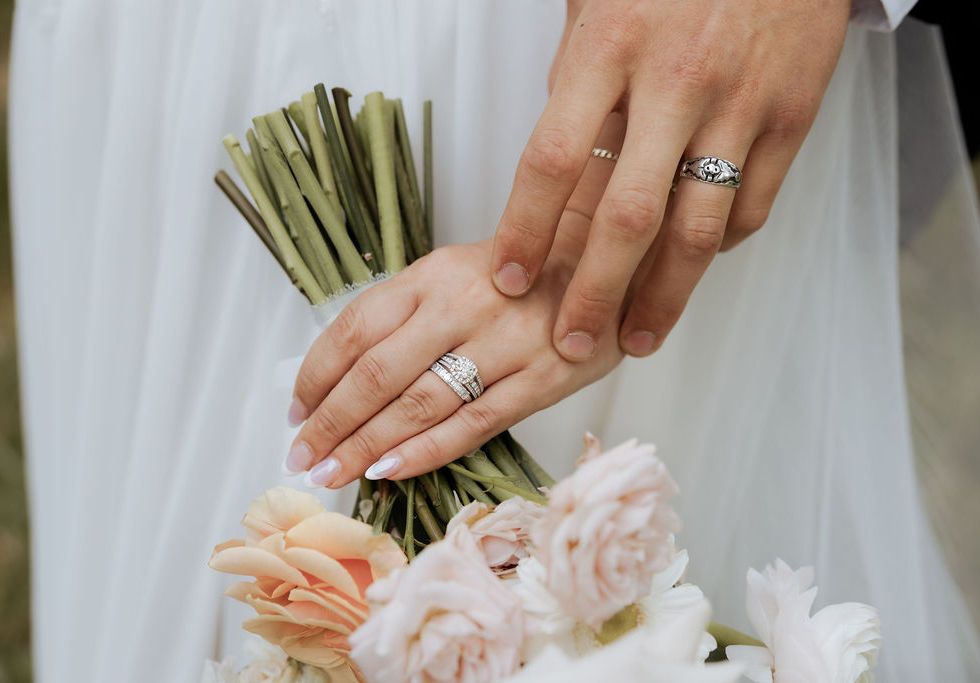 Bride holding a romantic pastel country-chic, garden-inspired