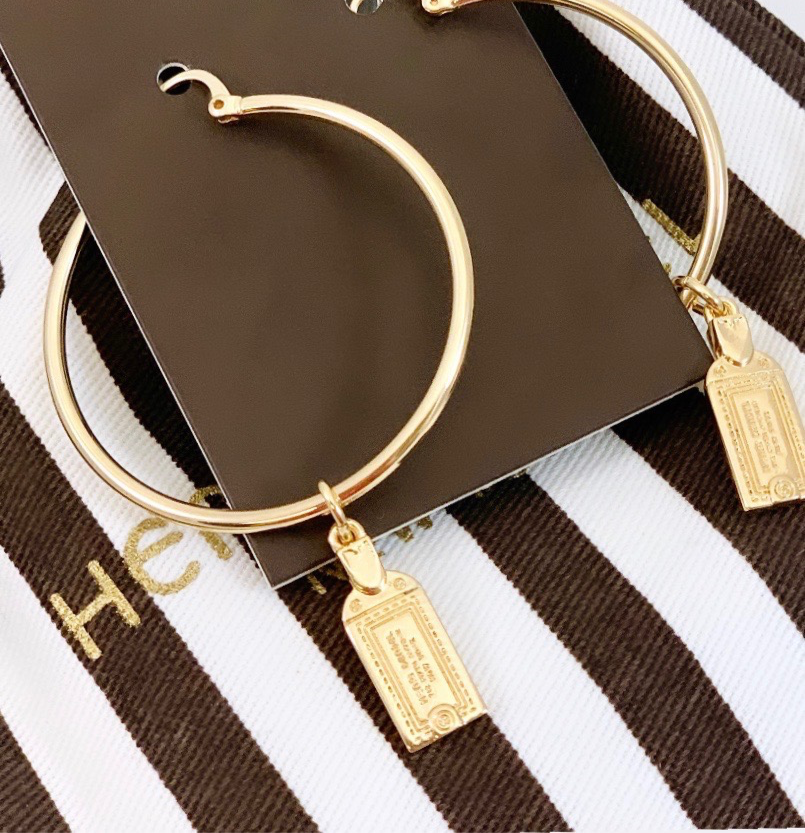 Thumbnail: Authentic Henri Bendel NY Luggage Tag Charm Gold Hoop Earrings