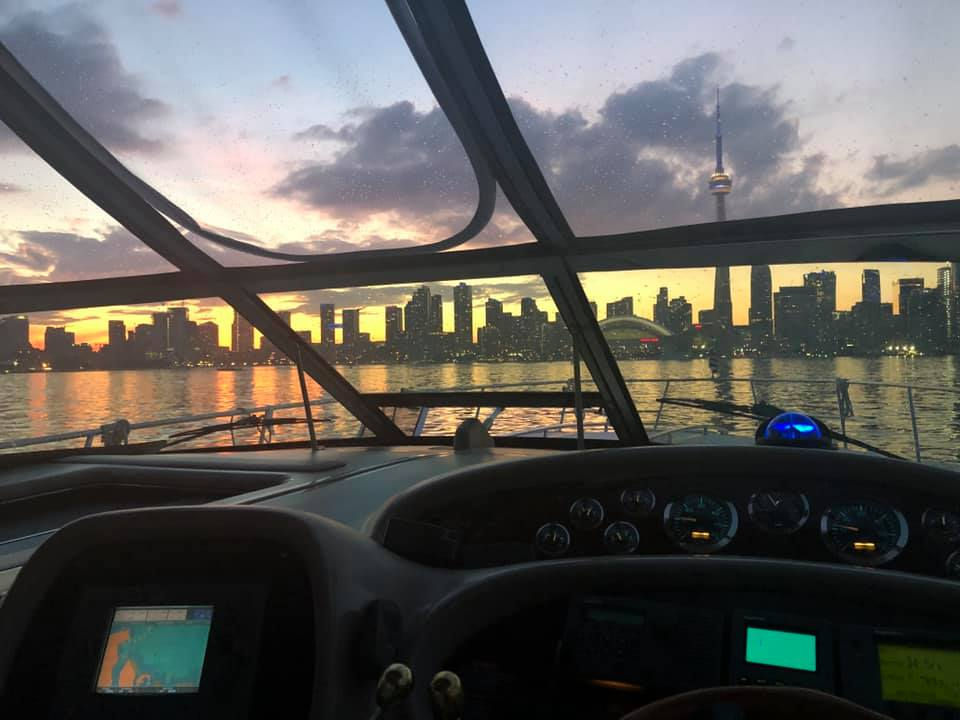 Toronto skyline at dusk from water