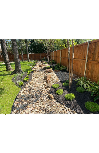 French Drain, Natural Rock Bed and Designer Plants Installed by Promise Landscaping. A Professional Landscaping Company.