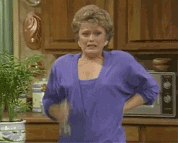 One of the golden girls sprays herself with water and takes a deep breath