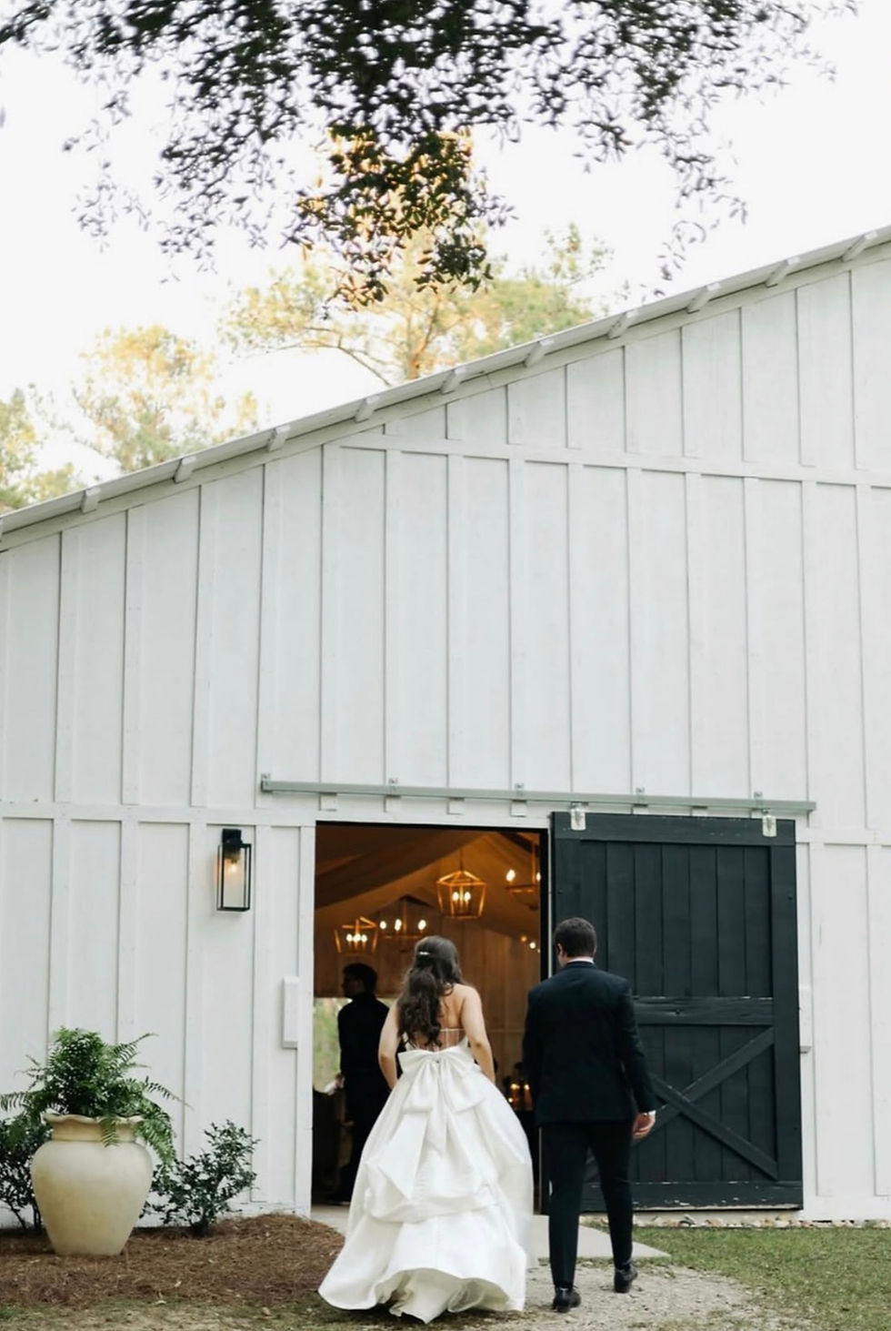 bride and groom walking into reception