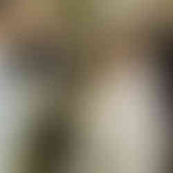 bride and groom running through wedding party