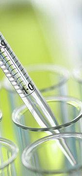 Pipette inserted into a test tube by a medical researcher whose grant is being supported by Melissa Waine.