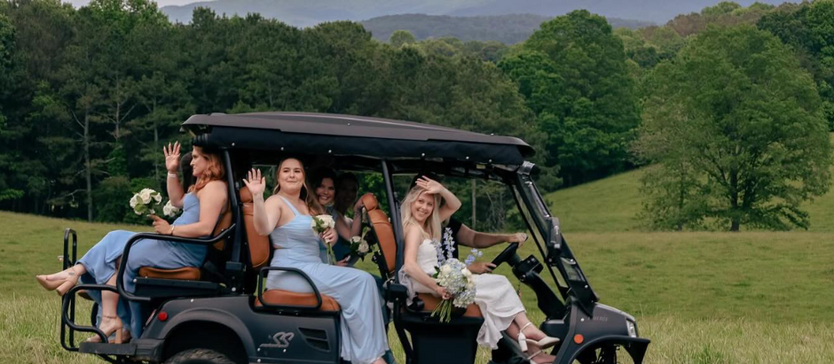 Wedding golf cart rental Boone NC helping guests arrive at reception