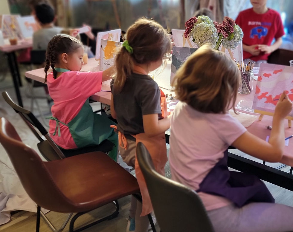 Children immersed in detailed painting activities, showcasing focus, creativity, and the calming effects of sensory engagement.