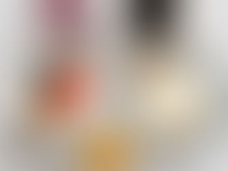 A top-down view of quick, healthy breakfast options on a light marble surface, including a berry smoothie, black coffee, Greek yogurt with berries and almonds, toast with two fried eggs, and a small bowl of overnight oats topped with peach pieces