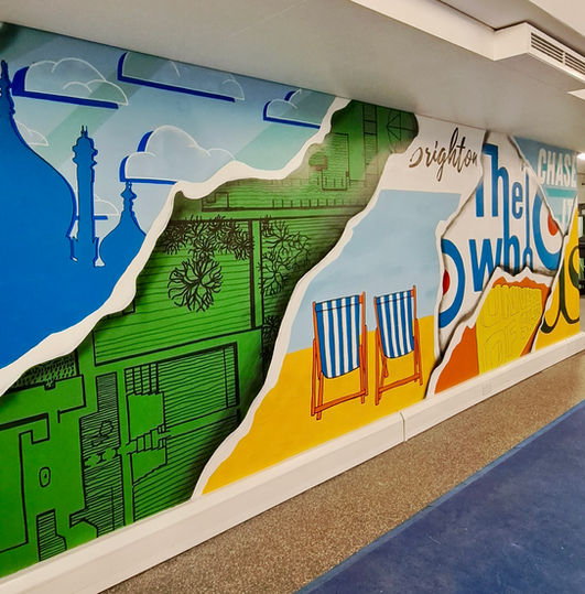 Ripped paper hand painted mural Brighton pavilion deck chairs beach spray paint the who Sussex University 
Ben Cav