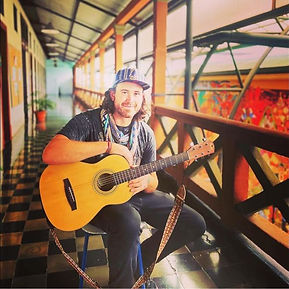 Sitting with guitar.jpg