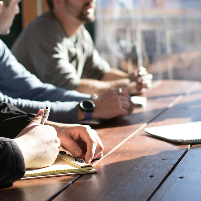 Small team of people at a meeting table