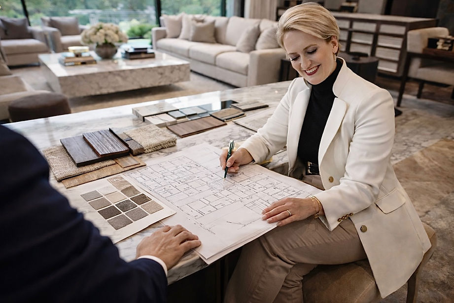 Editorial interior design planning with curated materials and floor plans guiding luxury home design decisions