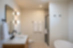 Bathroom with soaking tub in the Two Queen Suite at Adirondack Spruce Lodge