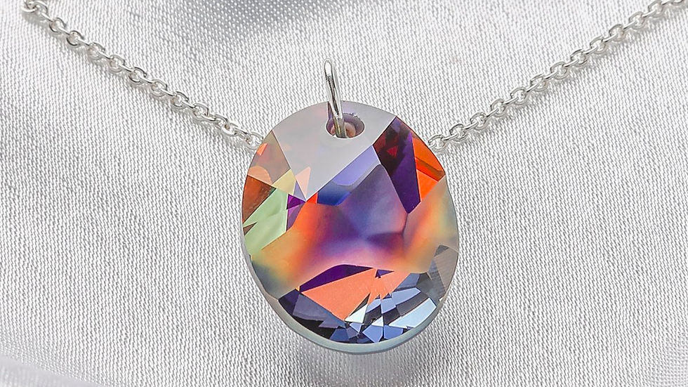 Luxury [sapphire] ring gemstone detail shot on soft grey silk for e-commerce.