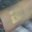 Thumbnail: Golden glitter swatch on skin, shimmering with light, showing product application.
