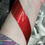 Thumbnail: Red lipstick swatch on a wrist, testing color and texture close-up.