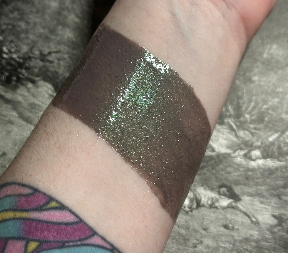 Thumbnail: Swatched shimmering lip gloss on wrist, Dark Matter - Sheer Berry Blue Shimmer Lip Gloss i.