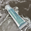 Thumbnail: Blue cosmetic tube on artistic background, product detail, skincare item.