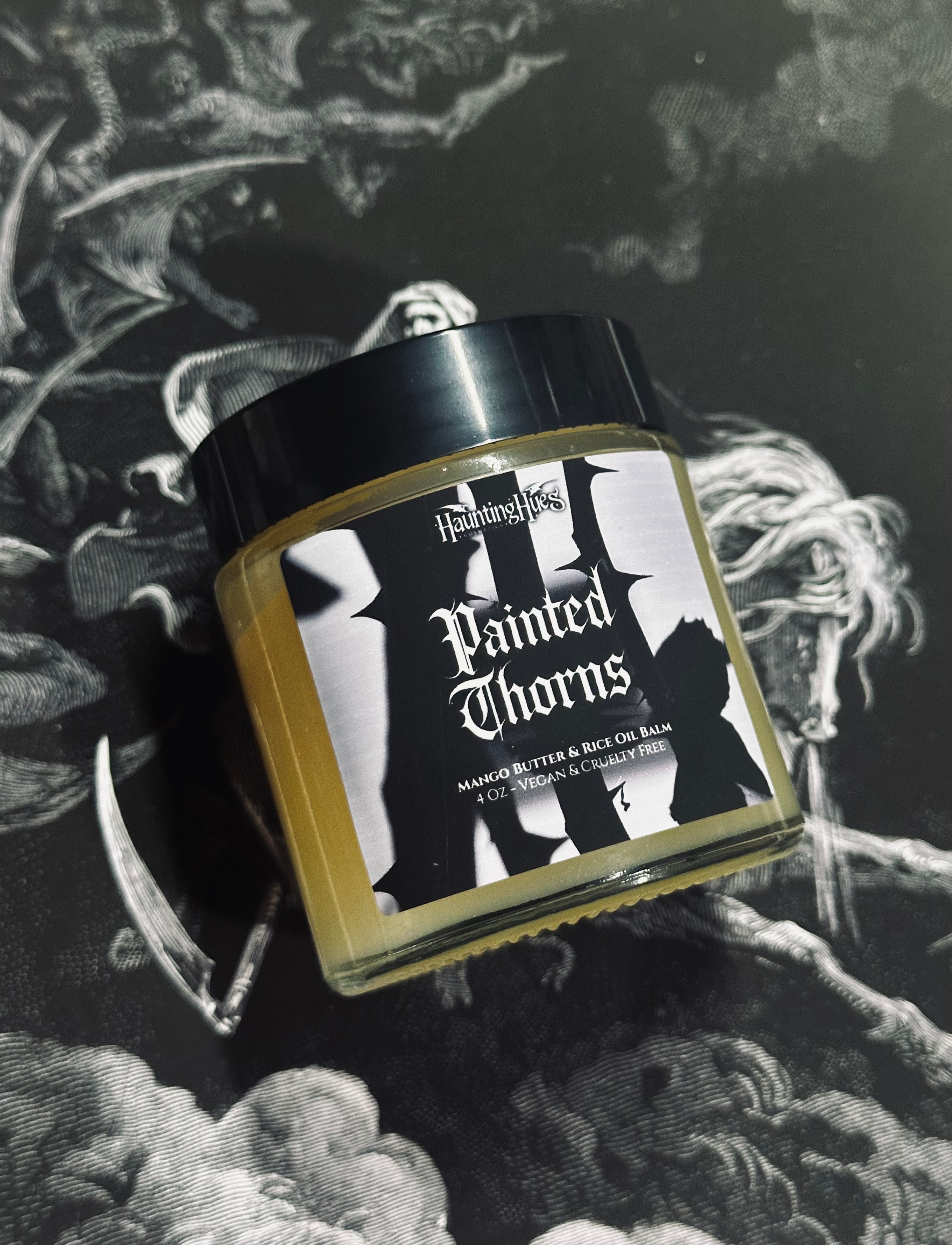 Painted Thorns jar with Gethsemane - Metallic Dark Green Pressed Eyeshadow on patterned background