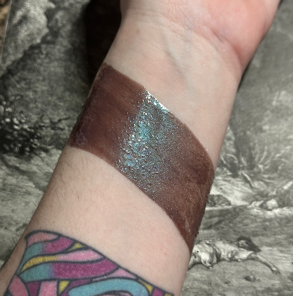 Brown swatch on wrist with shimmer, Devilish  Whispers - Green Shimmer Tone Velvet Creams.