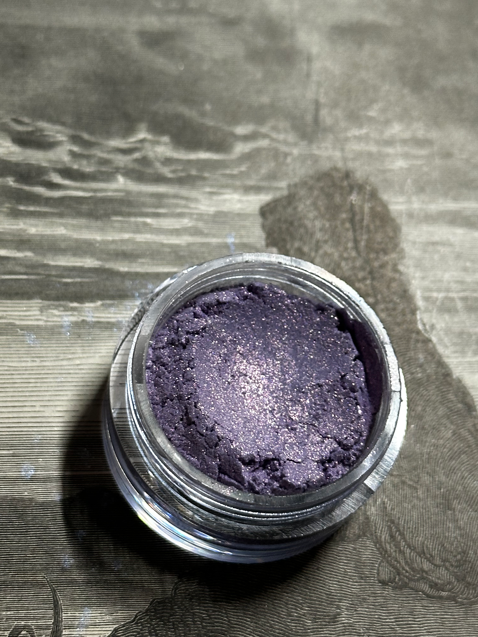 Thumbnail: Open jar of velvet cream eyeshadow. Devilish Whispers - Green Shimmer Tone Velvet Creams. Beauty product.
