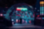 Futuristic subway entrance with neon lights, people entering. Night cityscape background with traffic, signs in Korean, and vibrant colors.