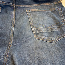 Scheur in broek herstellen