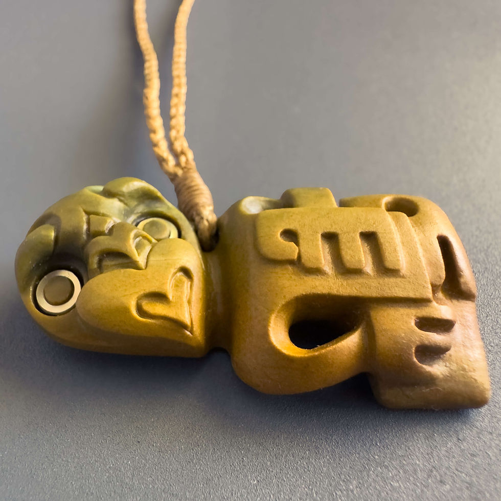Thumbnail: Closeup view of handcrafted Hei Tiki pendant from Aotearoa Stone Carving Studio