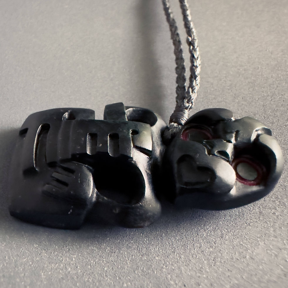 Thumbnail: Closeup view of handcrafted Hei Tiki pendant from Aotearoa Stone Carving Studio
