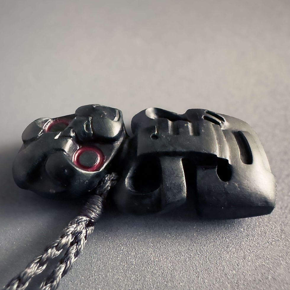 Thumbnail: Closeup view of handcrafted Hei Tiki pendant from Aotearoa Stone Carving Studio