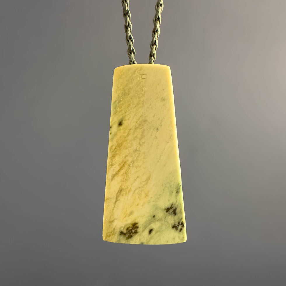 Rear view of handcrafted Hei Toki / Chisel pendant from Aotearoa Stone Carving Studio
