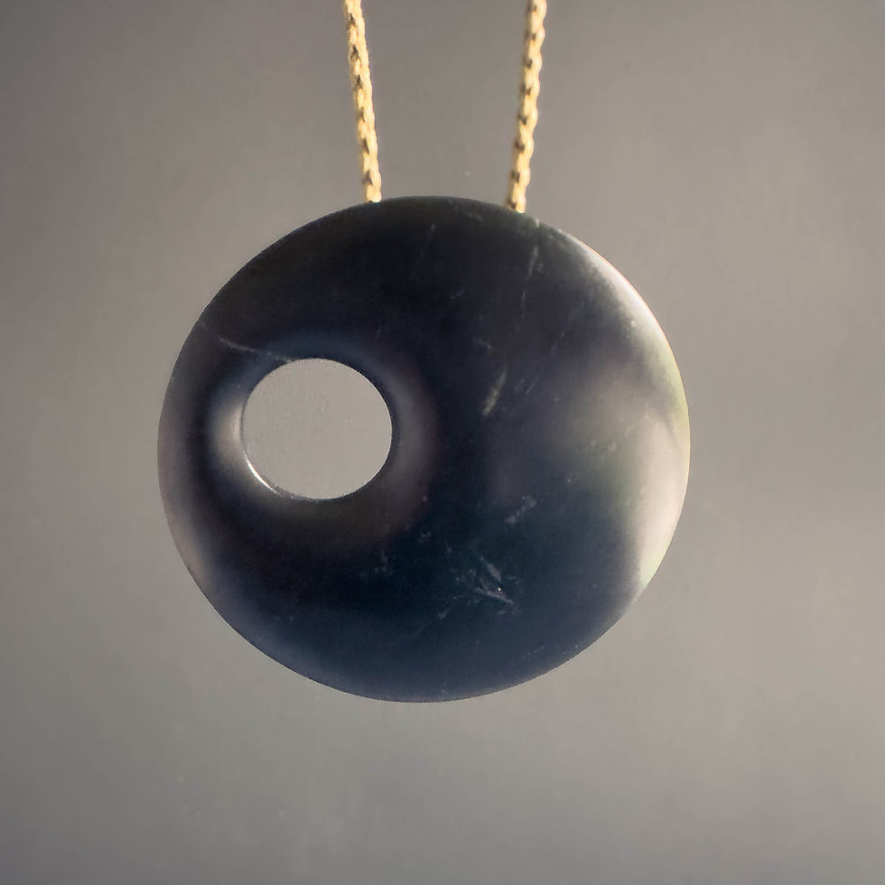 Front view of handcrafted Disc / Kopae pendant from Aotearoa Stone Carving Studio