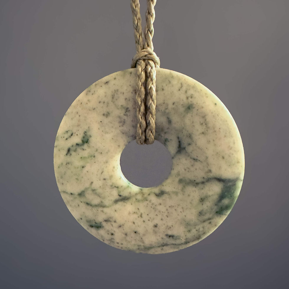 Front view of handcrafted Disc / Kopae pendant from Aotearoa Stone Carving Studio