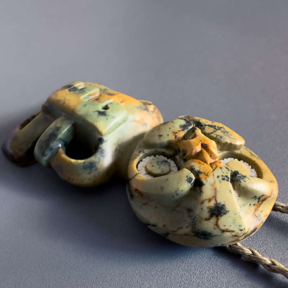 Thumbnail: Closeup view of handcrafted Hei Tiki pendant from Aotearoa Stone Carving Studio