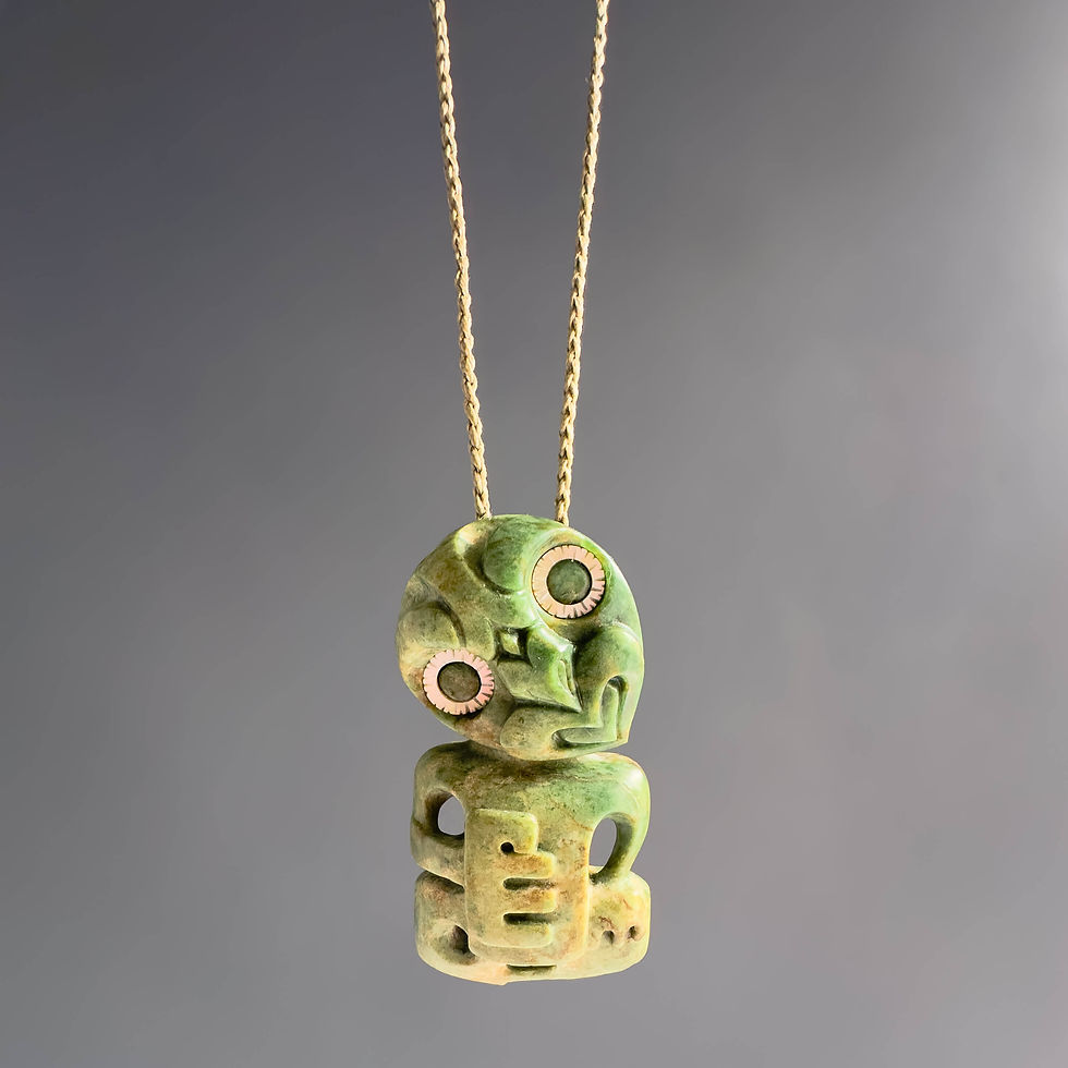Thumbnail: Wide view of handcrafted Hei Tiki pendant from Aotearoa Stone Carving Studio
